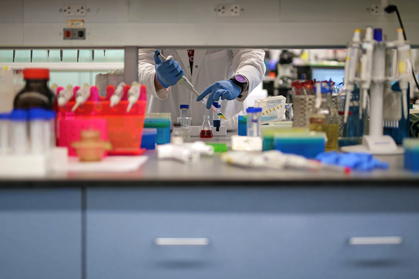 Researcher working in a modern university research laboratory